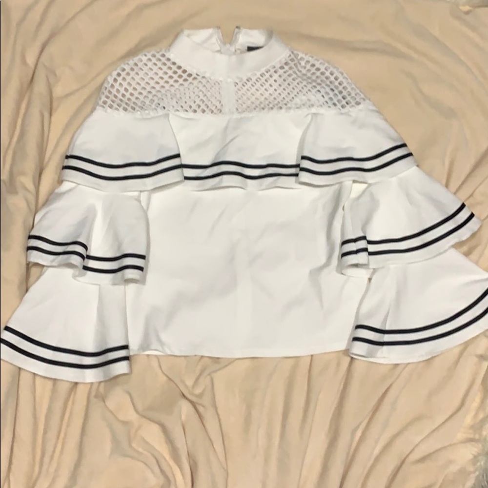 Have fun in this bell sleeved blouse!